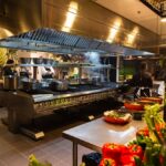 Bustling,Restaurant,Kitchen,With,Chefs,At,Work,,Vibrant,Vegetables,In